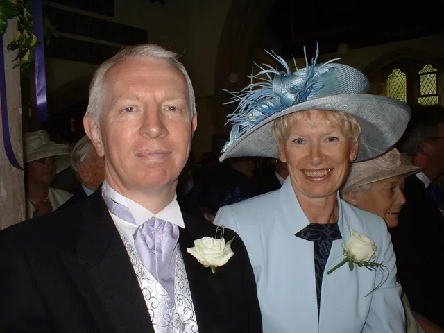 A close portrait of Iain and Pam smiling together.