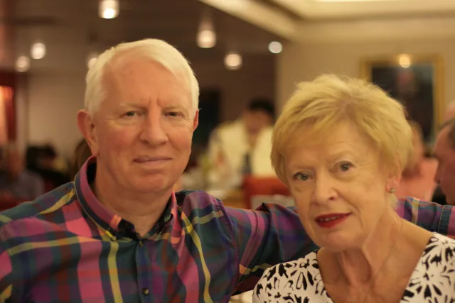 Iain and Pam smiling together at a celebration, September 2015.
