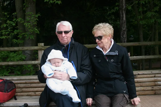 Iain and Pam at Center Parcs holding their grandson, Alex