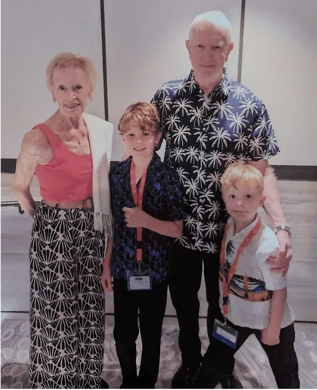 Pam and Iain on a cruise excursion with their two grandsons.
